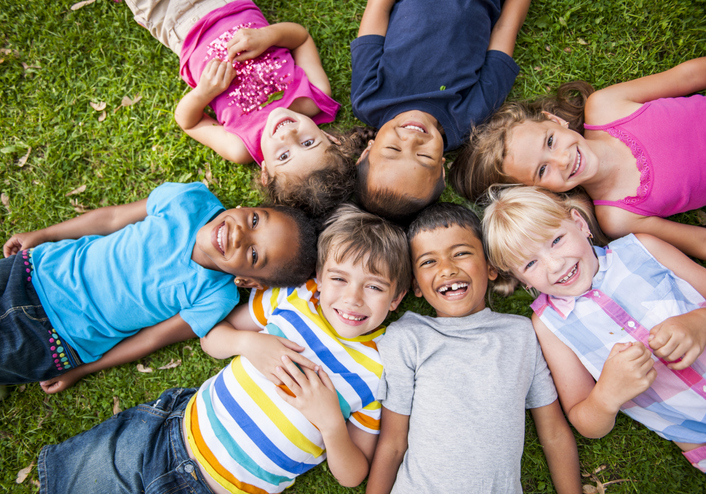 Children Laying in the Grass