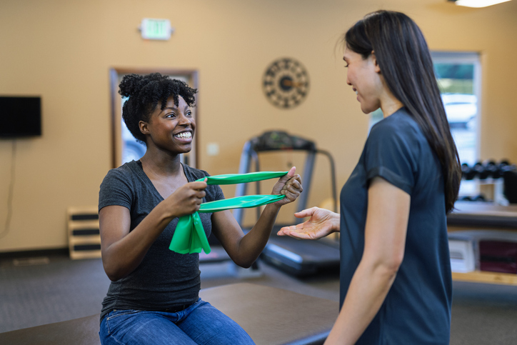 Woman with athletic trainer
