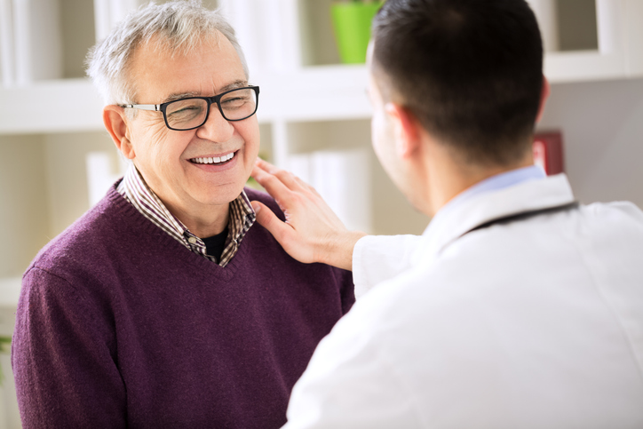 Doctor talking to smiling patient