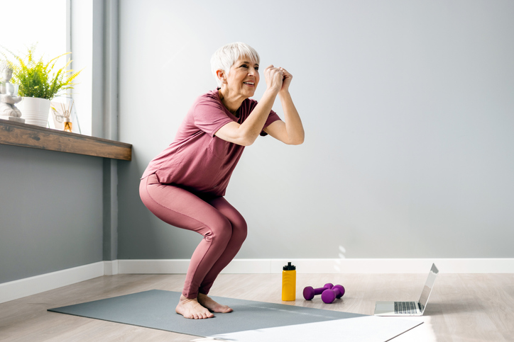 Woman doing yoga on mat