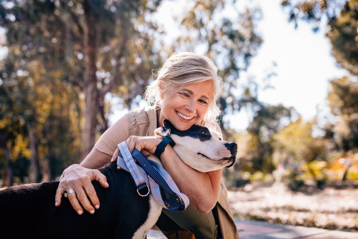 Woman hugging dog