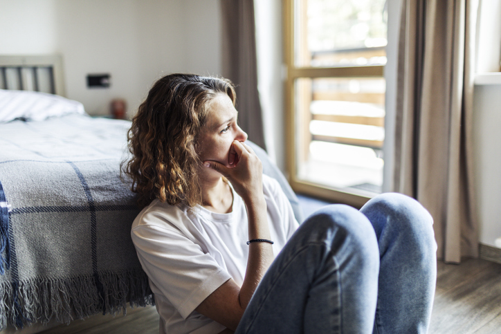 Woman sitting on floor