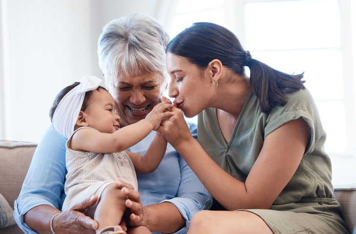 mature woman bonding with her daughter and granddaughter