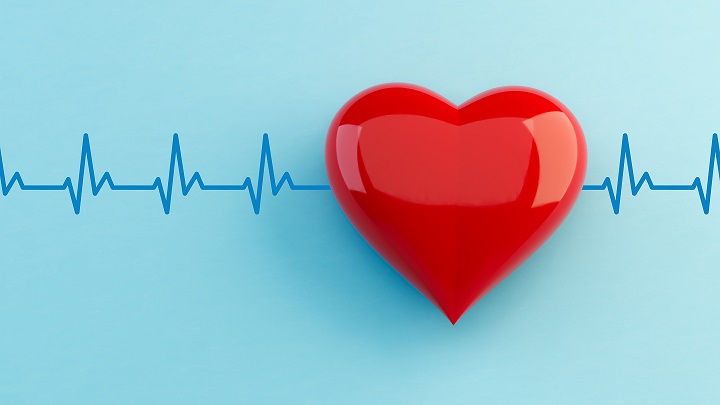 A heartbeat line runs behind a heart-shaped image