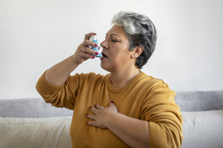 Woman Using Inhaler