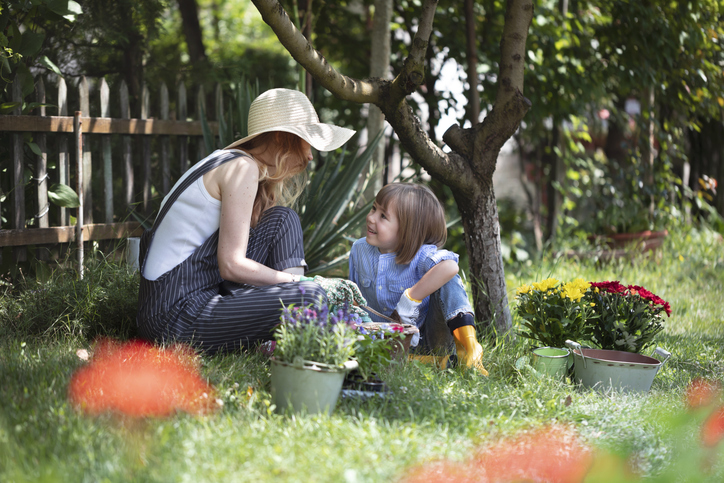 Mother and child sitting in the garden