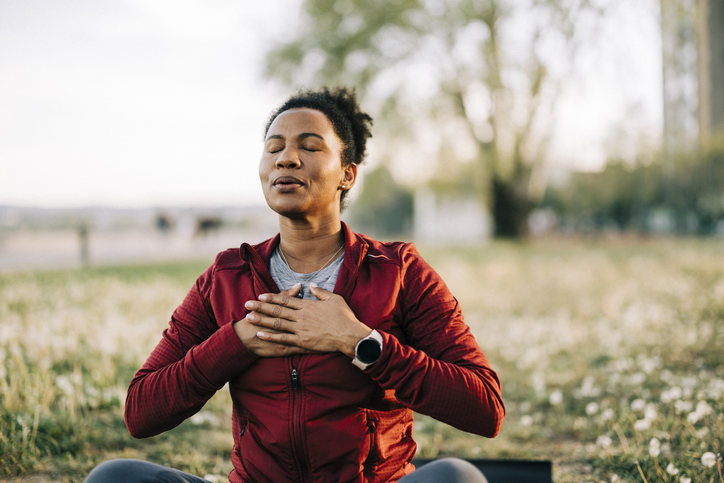 Woman Deep Breathing in the Park