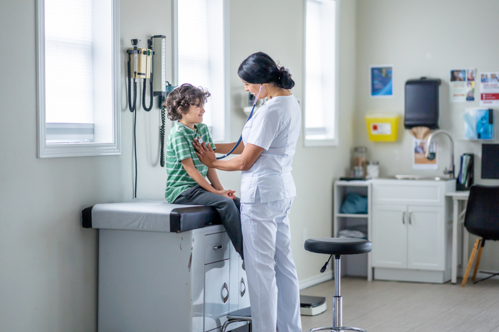 Young boy getting a physical