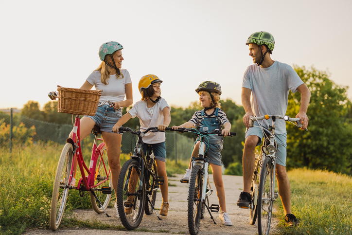 Family on Bike Ride Wearing Helmets
