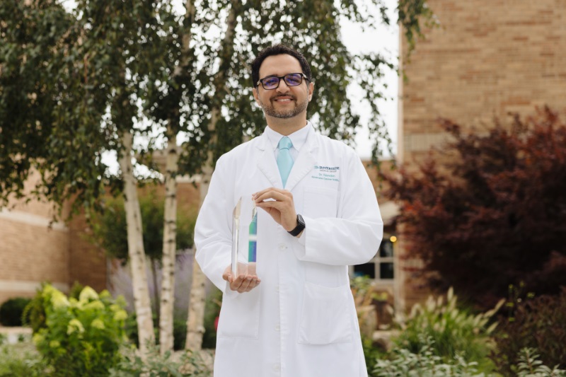 Dr. Joehar Hamdan holds the Samaritan of the Year award