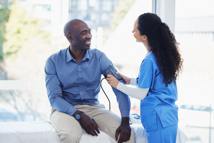 man, doctor and blood pressure healthcare in hospital
