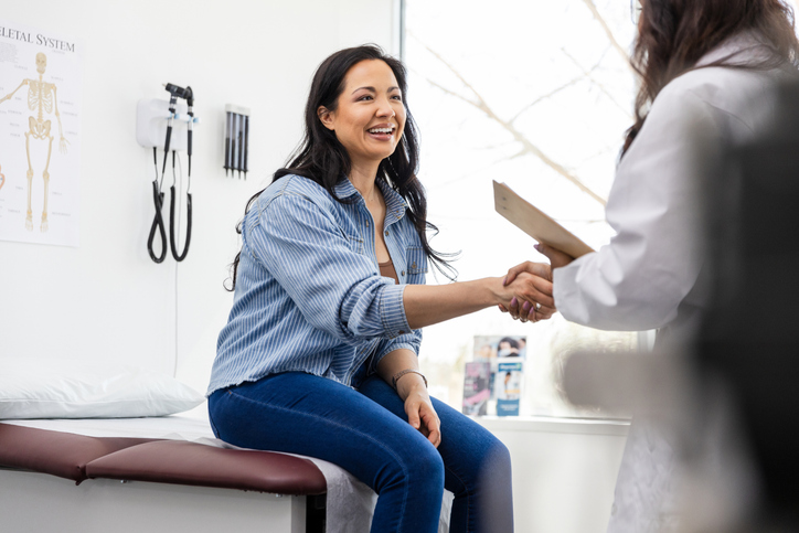 Woman Shaking Hands with Doctor