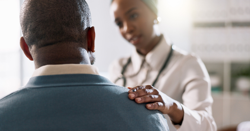 Primary care doctor listening to patient describing a health issue