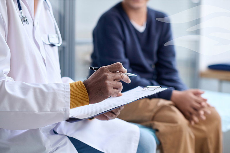 Riverside Provider talking with patient and taking notes