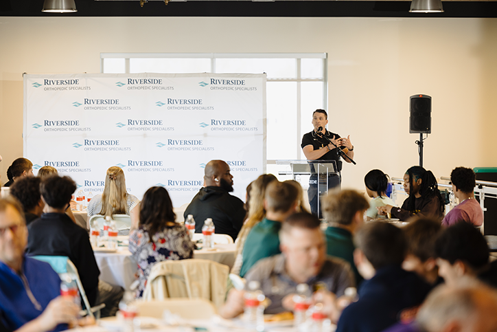 Riverside Healthcare Director of Rehabilitation Services Bryan Hack addresses the Scores for Schools audience