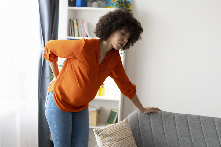 woman with sciatica indicating lower back pain