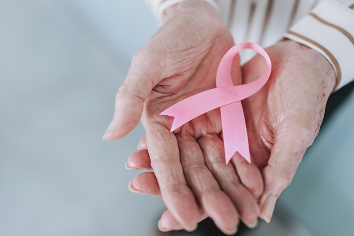 Hands holding breast cancer ribbon