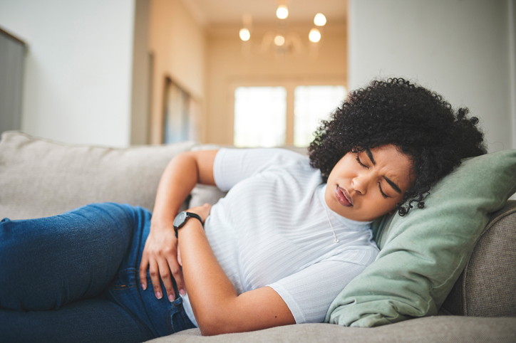 Image of young women with a stomach ache