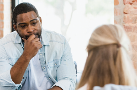 man speaks with therapist