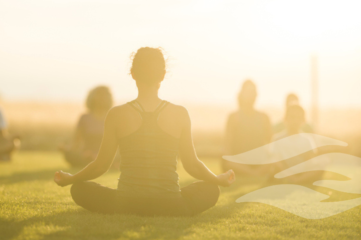 Woman leads yoga class