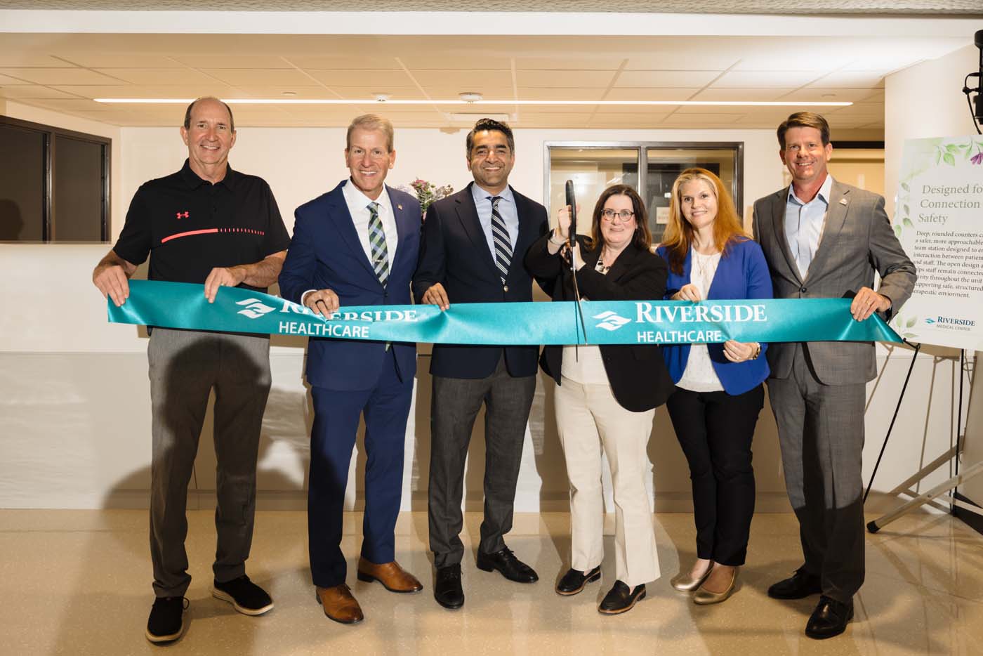 Riverside leaders and Kankakee Mayor Chris Curtis cut a teal ribbon to open the new adult inpatient behavioral health unit.